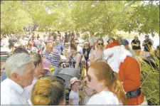  ??  ?? The crowd enjoying the morning, including Santa’s visit