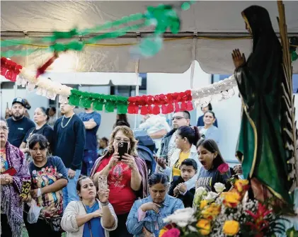  ?? Rebecca Blackwell/Associated Press ?? St. Ann Mission’s annual festival for the Virgin of Guadalupe drew thousands on Dec. 10 to its most important event of the year to raise funds for its program to minister to migrant farm workers. The mission near Miami was founded in 1961.