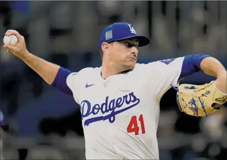  ?? DANIEL HUDSON, Associated Press ?? shown pitching on Sunday in Seoul, is looking to bounce back with the Dodgers after two injury-plagued seasons.