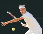  ?? Shaun Botterill / Getty Images ?? Roger Federer sets up to unleash one of his trademark forehands that helped him roll through the field without losing a set on his way to the final.