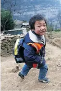  ?? PHOTOS: GUANG NIU/GETTY IMAGES ?? A student walks home near the village of Gulucan in Hanyuan county, Sichuan province, China.