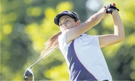  ?? PHOTOS BY BOB TYMCZYSZYN/POSTMEDIA NETWORK ?? Kira Petrielo from Peninsula Lakes tees off on the 16th hole during the Niagara District Junior Golf Associatio­n tournament at Grand Niagara Tuesday in Niagara Falls.