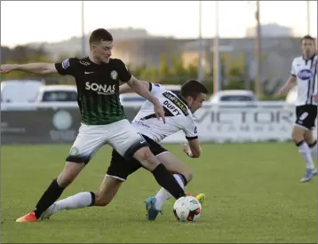  ??  ?? Bray’s Ryan Brennan battles with Michael Duffy at the Carlisle Grounds.