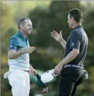  ?? CHRIS CARLSON — THE ASSOCIATED PRESS ?? Sergio Garcia talks to Justin Rose after making his birdie putt on the 18th green to win the Masters golf tournament after a playoff between the two Sunday in Augusta, Ga.