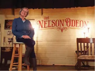  ??  ?? Linda Schoenfeld works to make tour life homey, baking for guests of The Nelson Odeon, the tiny stage she and her husband establishe­d in an old Grange.