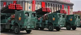  ??  ?? Real or fake? Military vehicles carry rockets in the parade