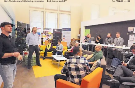  ?? KEVIN ROBINSON-AVILA/JOURNAL ?? Charles White, left, and Eric Renz Whitmore lead a group discussion at 1 Million Cups on Wednesday at the FatPipe incubator Downtown.