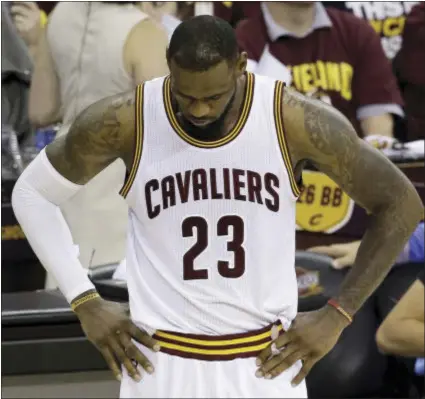  ?? THE ASSOCIATED PRESS ?? Cleveland Cavaliers forward LeBron James hangs his head Tuesday night as the Golden State Warriors won the NBA Finals.