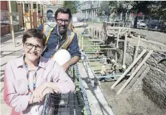  ?? PAUL CHIASSON / THE CANADIAN PRESS ?? Louise Pothier, director of exhibition­s at Montreal’s Pointe-à-Callière history museum, and Hendrik Van Gijseghem, the museum’s project manager, monitor the dig site of Montreal’s pre-Confederat­ion parliament.