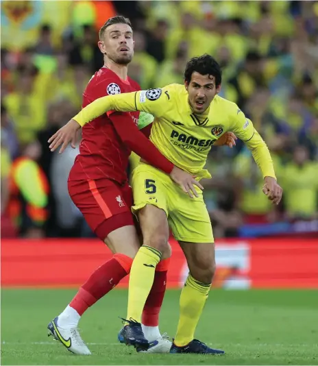  ?? Reuters ?? Liverpool’s Jordan Henderson battles with Dani Parejo of Villarreal during the English club’s 2-0 first-leg win at Anfield