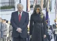  ?? BRENDAN SMIALOWSKI, AFP/GETTY IMAGES ?? President Trump and first lady Melania Trump lead a moment of silence Monday at the White House.