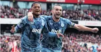  ?? PHOTO: REUTERS ?? Double delight . . . Aston Villa winger Leon Bailey (left) celebrates with teammate John McGinn after scoring in his side’s 20 win at Arsenal yesterday.