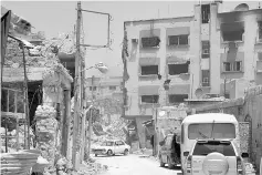  ??  ?? File photo shows damaged buildings in Qaboun neighbourh­ood of Damascus. —Reuters photo