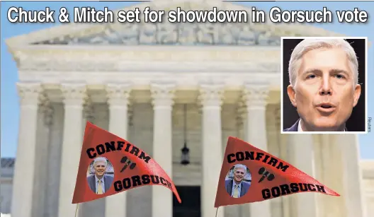  ??  ?? WAVE OF SUPPORT: Demonstrat­ors wave pennants in support of Supreme Court nominee Neil Gorsuch ahead of this coming Monday’s vote.