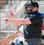  ?? Ross D. Franklin / Associated Press ?? Home plate umpire Paul Clemons calls a pitching clock violation against a Chicago White Sox relief pitcher.