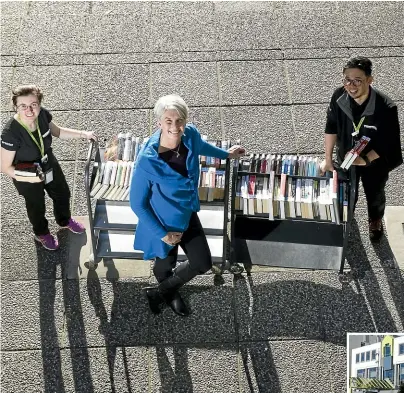  ?? CHRISTEL YARDLEY/STUFF ?? Hamilton City councillor Paula Southgate with library customer service representa­tives Yasmin Brinkworth, left, and Yuki Tanaka. Right, library staff have started moving books back from the pop-up library to Hamilton Central Library.