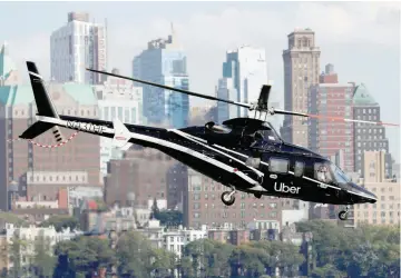  ?? — Reuters ?? A helicopter operated by Uber Copter, a new service by the ride-sharing company Uber, takes off from Manhattan, New York, US, October 2, 2019.