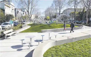  ?? Michael Short / Special to The Chronicle ?? South Park’s latest makeover — one of many in its 160 years — is inclusive, from the streamline­d play structure, to benches with armrests to accommodat­e laptops, to space for homeless people to stretch out.