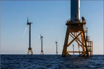  ?? PHOTO: JOHN MOORE — GETTY IMAGES ?? Wind turbines generate electricit­y at the Block Island Wind Farm on July 7, 2022near Block Island, Rhode Island. Only two offshore wind farms are online off the coast of the United States.