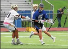  ?? AUSTIN HERTZOG - DIGITAL FIRST MEDIA ?? Downingtow­n West’s Zach Lee (12) wins the ball off a faceoff as Spring-Ford’s Kyle Mason defends during a District 1-3A playback game Tuesday at Spring-Ford.