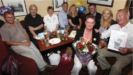  ??  ?? Tributes have been paid to former Evening Times journalist Allan Caldwell, right, and above, at a celebratio­n with colleagues at the newspaper in 2010