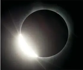  ?? ASSOCIATED PRESS ?? The moon almost eclipses the sun during a near total solar eclipse as seen from Salem, Ore., Monday.