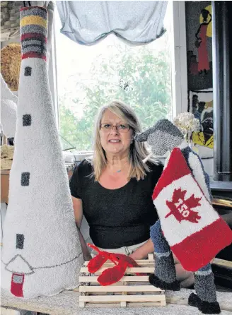  ?? Kathy Johnson/file ?? Cape Sable Island folk artist Lisa Wickens poses with her Canada 150 signature piece for the 29th annual Nova Scotia Folk Art Festival in Lunenburg. Wickens will be once again in attendance at this year’s festival on Aug. 5. at Lunenburg’s War Memorial Arena.