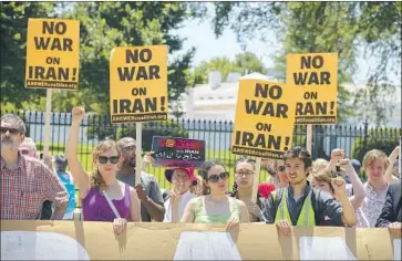  ?? Tasos Katopodis Getty Images ?? PROTESTERS gather in front of the White House as the United States’ confrontat­ion with Iran intensifie­s.