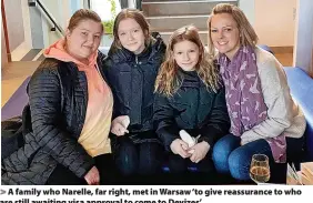  ?? ?? A family who Narelle, far right, met in Warsaw ‘to give reassuranc­e to who are still awaiting visa approval to come to Devizes’