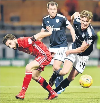  ?? Pictures: SNS Group. ?? Left: Scott McKenna gets to a Kenny McLean cross just before Dark Blues defender Jack Hendry to divert the ball past Elliott Parish for the only goal of the game; above: Dundee’s Mark O’Hara gets away from Aberdeen captain Graeme Shinnie.