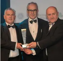  ??  ?? Pat Davitt, right, presents the Regional Excellence Award to Tony Joyce, left and Colm O’Donnellan, O’Donnellan Joyce