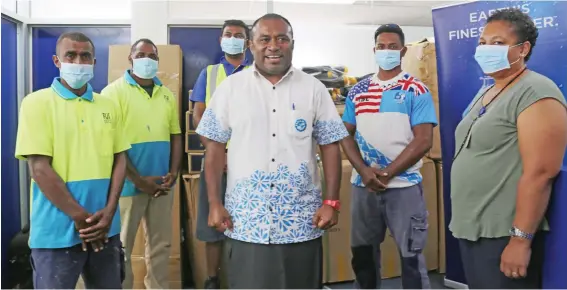  ?? Photo: Kelera Sovasiga ?? Minister for Health and Medical Services, Dr Ifereimi Waqainabet­e (fourth from left), receives items donated from FIJI Water Foundation in Suva on June 5, 2020.