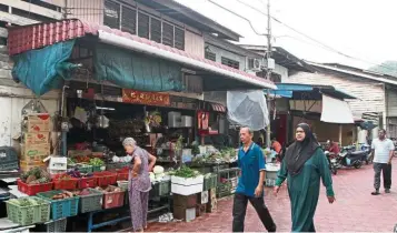  ??  ?? Old and new: Pangkor is a meld of old and new, where visitors can stroll down its idyllic streets to experience life as a local.