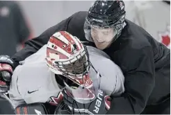  ?? NATHAN DENETTE/ THE CANADIAN PRESS, FILE ?? Canada goalie Malcolm Subban is hugged by teammate Dougie Hamilton in practice at the World Junior Hockey Championsh­ip.