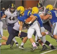  ?? PETE BANNAN — DIGITAL FIRST MEDIA ?? Downingtow­n East’s Tim Aivado (3) runs in the third quarter against Unionville.