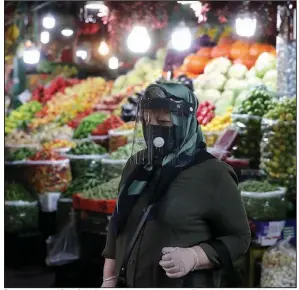  ?? (AP/Ebrahim Noroozi) ?? A woman ventures through the Tajrish traditiona­l Iranian bazaar Thursday in northern Tehran. Eight months after the coronaviru­s pandemic first stormed Iran, authoritie­s appear just as helpless to prevent its spread. More photos at arkansason­line.com/1016virus/.