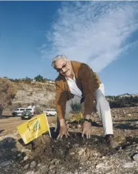  ?? (Courtesy JNF) ?? ‘A LOT of people my age are retired and I have no intentions of doing that. I’m continuing to act and do my concerts and keep doing more of the same,’ says Emmy-award wining actor Hal Linden, seen here planting a tree in the Judean Hills.