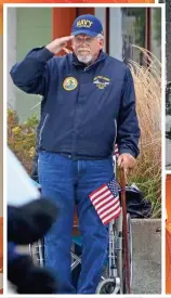  ?? DAVE KALLMANN/ MILWAUKEE JOURNAL SENTINEL ?? Navy veteran Ralph Kessler of St. Francis steps out of his wheelchair to salute as the 2017 Veterans Day Parade passes. The 2018 parade is Saturday.