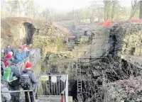  ??  ?? East Cheshire Ramblers pause to look at the excavation of the former Mellor Mill