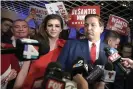  ?? Photograph: Phelan M Ebenhack/AP ?? The then Florida governor-elect, Ron DeSantis, right, answers questions from reporters, with his wife Casey, after being declared the winner of the Florida gubernator­ial race in November 2018.