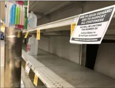  ?? PHOTO VINCENT OSUNA ?? A sign that states, “We will be limiting the number of gallon water to 5 each per customer” hangs on the shelves Thursday at Vons in El Centro.