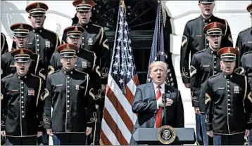  ?? EVAN VUCCI/AP ?? President Donald Trump sings the anthem at the White House in lieu of an appearance by the Super Bowl champs.