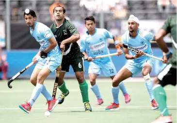 ??  ?? Dilpreet Singh (left) in action against Pakistan in their opening match of the Champions Trophy hockey tournament in Breda, the Netherland­s, on Saturday. India won 4-0 with 17-year-old Dilpreet getting one of the goals.