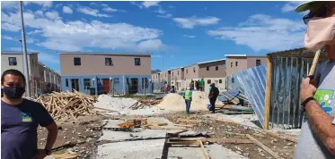  ??  ?? A WEEK ago, a group of youths from Masiphumel­ele allegedly petrol-bombed some of the temporary housing structures set up by the City for the December fire victims. The group is also said to have taken some of the building material.