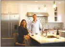  ??  ?? Restaurant­eur Rebecca Illingwort­h and her husband, chef Thierry Penichot, in their renovated kitchen. (Jeff Wheeler/TNS)