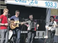  ??  ?? Ceol an Aire entertain the crowd with the help of Oban FM. 07_t13PlayThi­sGameToget­her08