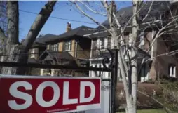  ?? GRAEME ROY/THE CANADIAN PRESS FILE PHOTO ?? Detached home prices in the 905 areas fell 12 per cent to an average of $879,048.
