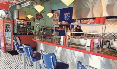  ??  ?? Inside Bing’s Burger Station in Cottonwood is a classic diner setting.