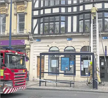  ??  ?? Fire crews on the High Street in Maidstone sealed and closed windows on the TSB Bank building. Right: The shattered glass and the clear-up operation