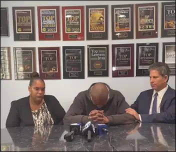  ?? SCREENSHOT ?? Attorney Brad Gage (right) comforts Lamont Finlayson, father of Niani Finlayson, the 27-yearold mother of two who was shot and killed Dec. 4 by a Los Angeles County sheriff’s deputy, as Tracie Hall, Niani’s mother, sits by during a Thursday morning press conference at Gage’s Woodland Hills office.